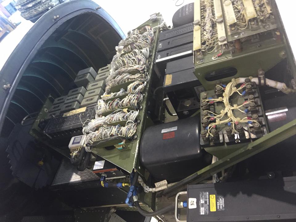 Mobile avionics service van with business jets in hangar