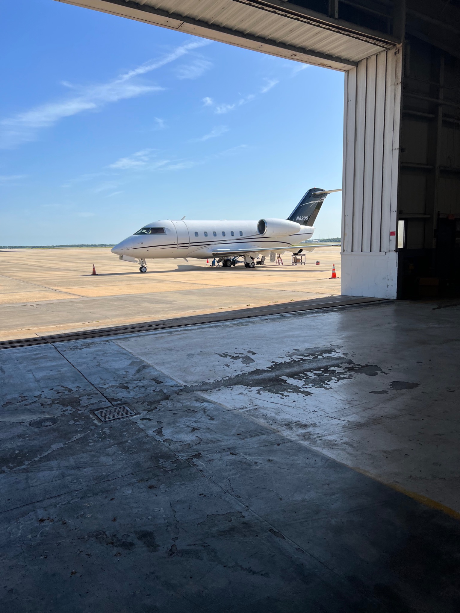 Business jet outside hangar for onsite avionics service