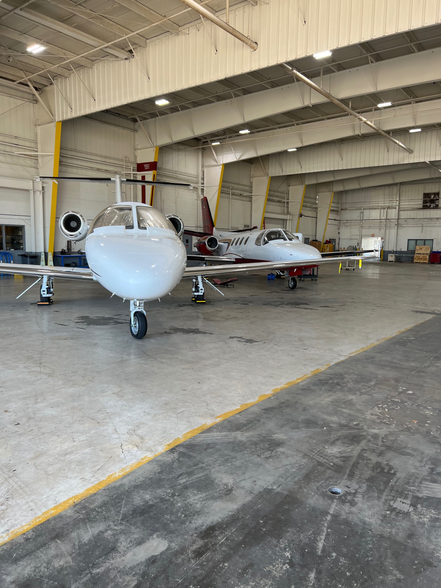 Business jets in maintenance hangar